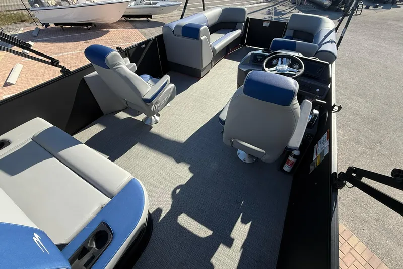 Slide: The Image of 2024 Bennington SSB-SPS pontoon boat interior with gray and blue seating. - 7