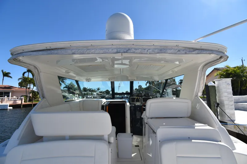Slide: The Image of 2006 Tiara Yachts 3600 Open, rear view, docked under clear blue sky. - 12
