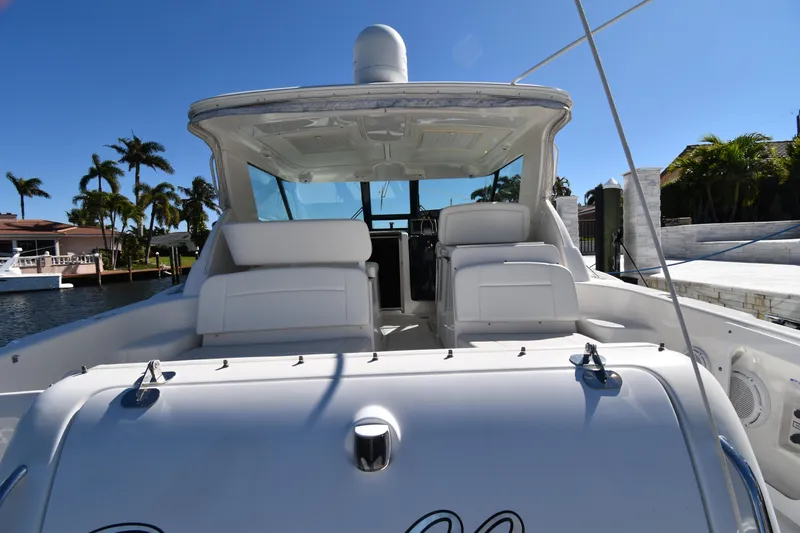 Slide: The Image of 2006 Tiara Yachts 3600 Open, rear view, docked with palm trees in the background. - 14