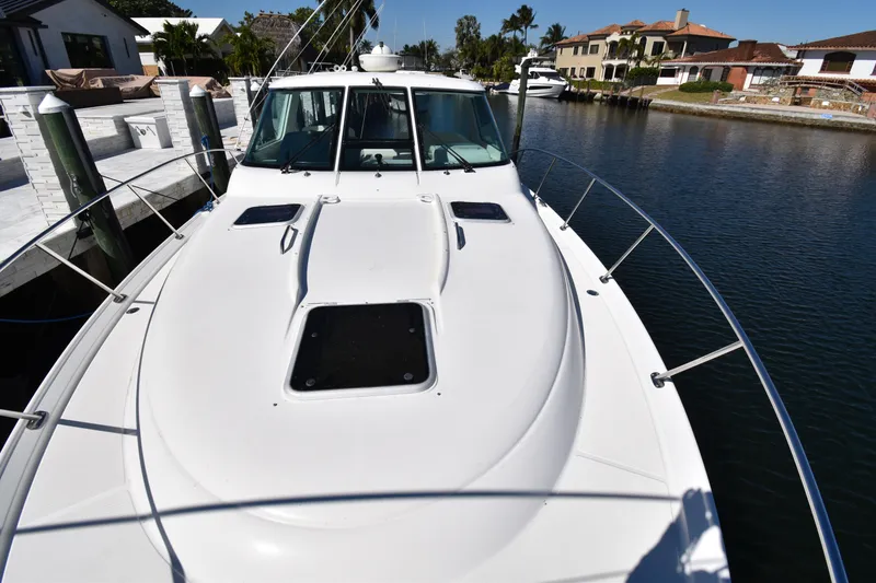 Slide: The Image of 2006 Tiara Yachts 3600 Open on a serene waterfront dock. - 17
