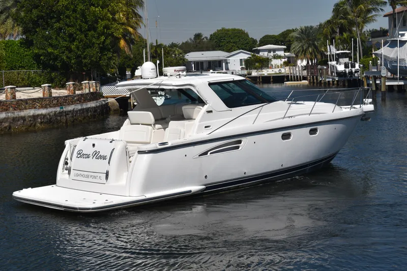 Slide: The Image of 2006 Tiara Yachts 3600 Open cruising in a scenic waterfront setting. - 2