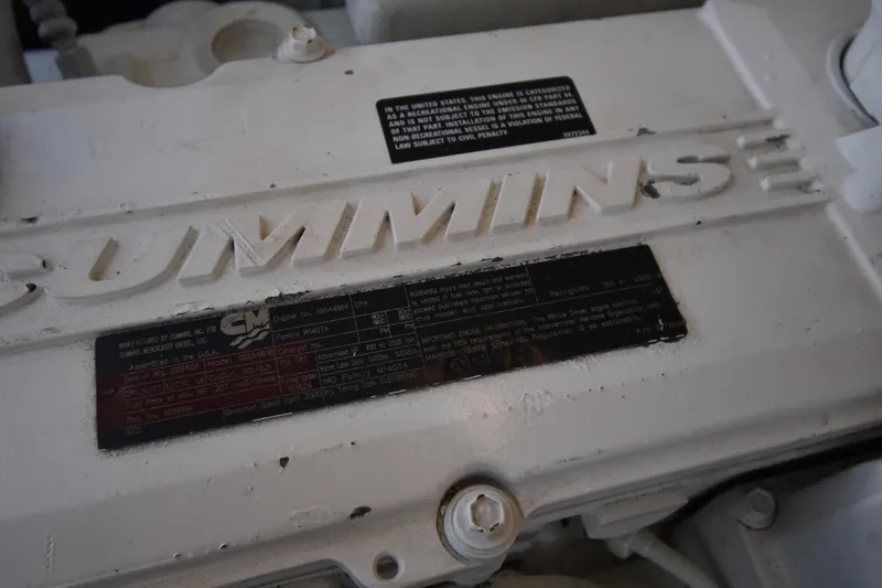 Slide: The Image of Engine detail of a 2006 Tiara Yachts 3600 Open, showcasing Cummins branding. - 32