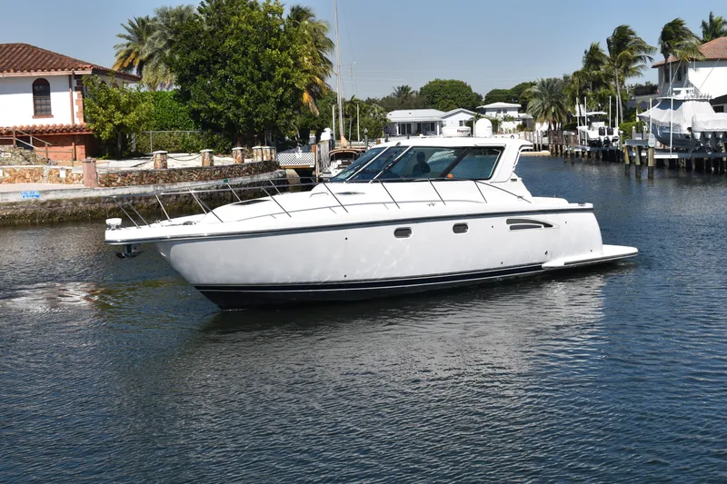 Slide: The Image of 2006 Tiara Yachts 3600 Open cruising in a scenic waterfront setting. - 5