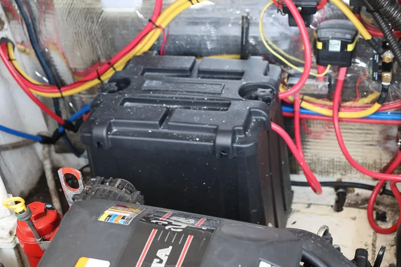 Slide: The Image of 2014 Regal 30 Express engine compartment with wiring and battery box. - 60