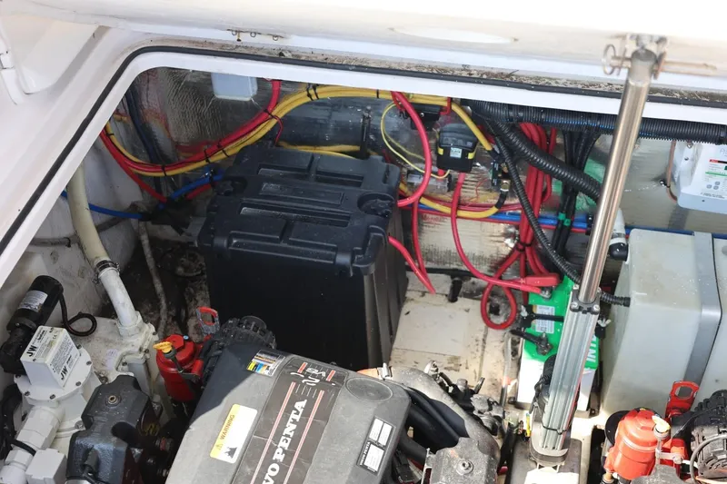 Slide: The Image of Engine compartment of 2014 Regal 30 Express boat with wiring and components visible. - 62