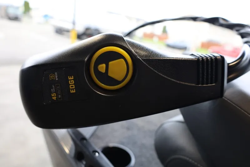 Slide: The Image of Close-up of a 2025 Lowe Skorpion 17 boat control panel with Edge motor. - 12