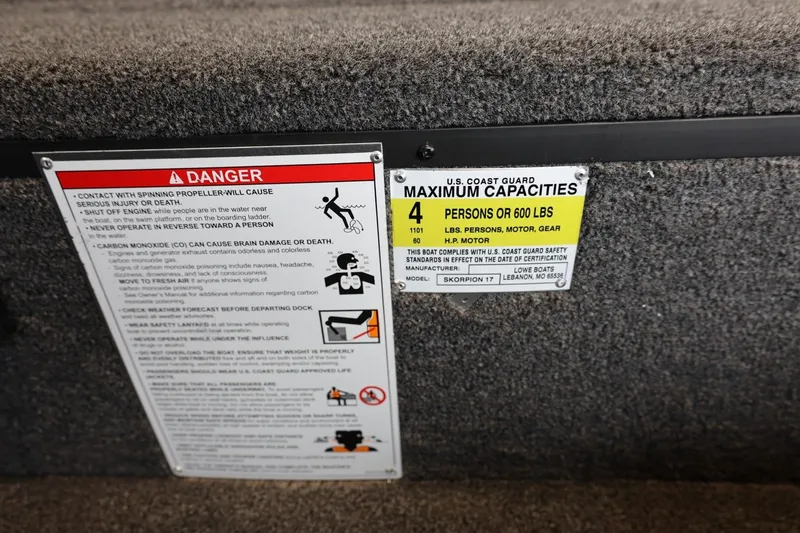 Slide: The Image of Safety and capacity labels on 2025 Lowe Skorpion 17 boat, indicating maximum load and warnings. - 16
