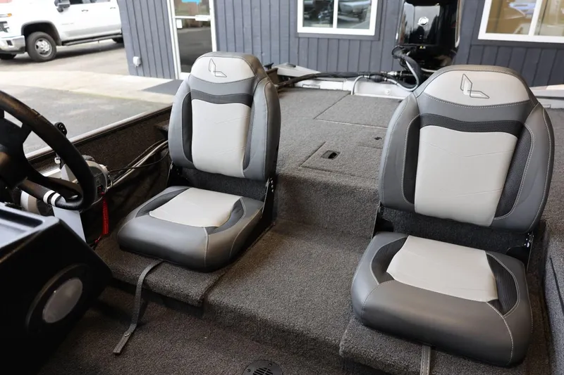 Slide: The Image of 2025 Lowe Skorpion 17 boat interior with dual gray and white seats. - 18