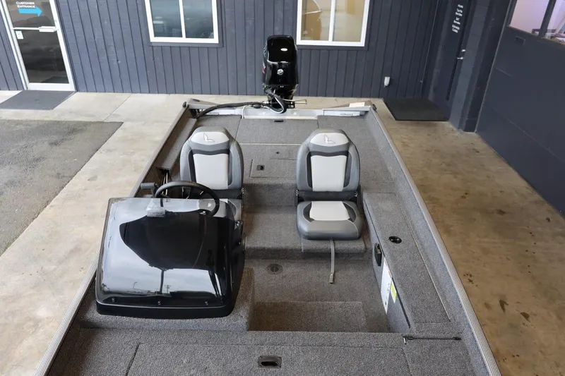 Slide: The Image of 2025 Lowe Skorpion 17 boat interior with dual seats and steering console. - 24