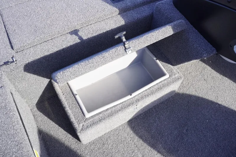Slide: The Image of Open storage compartment on 2025 Lowe Skorpion 17 boat deck. - 26