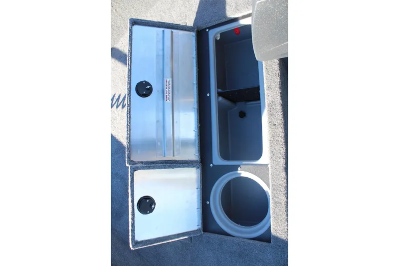 Slide: The Image of 2026 Tracker Pro Guide V-16 SC boat storage compartments open, showcasing interior design. - 13