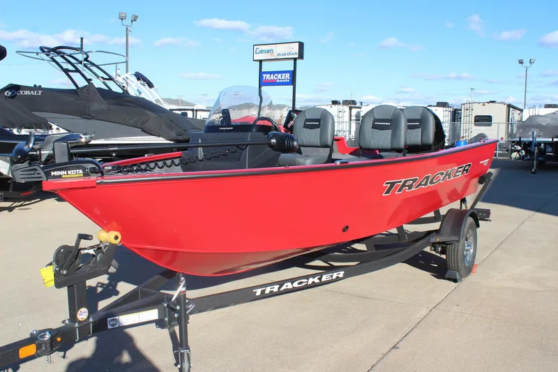 Slide: The Image of 2026 Tracker Pro Guide V-16 SC boat, red, on trailer at dealership. - 3