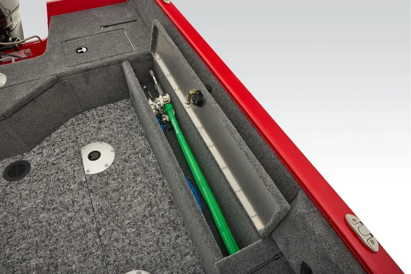 Slide: The Image of Manufacturer Provided Image: 2026 Tracker Pro Guide V-16 SC boat interior with rod storage and carpeted flooring. - 47