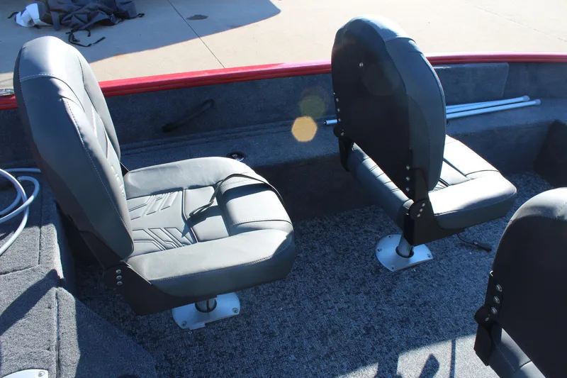 Slide: The Image of 2026 Tracker Pro Guide V-16 SC boat interior with two cushioned seats. - 7