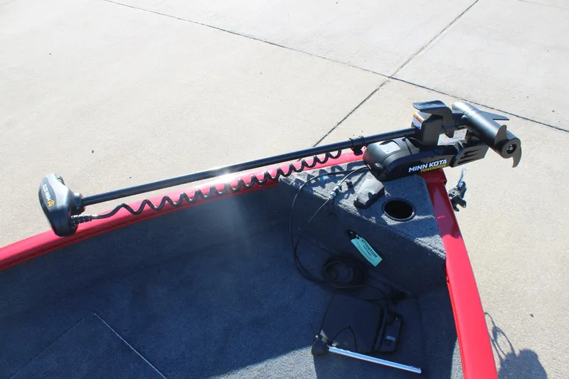 Slide: The Image of 2026 Tracker Pro Guide V-16 SC with Minn Kota trolling motor on red deck. - 9