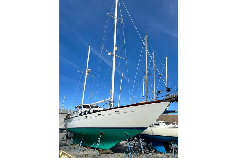 Slide: The Image of 1971 Alden Boothbay Explorer sailboat on stands under clear blue sky. - 10