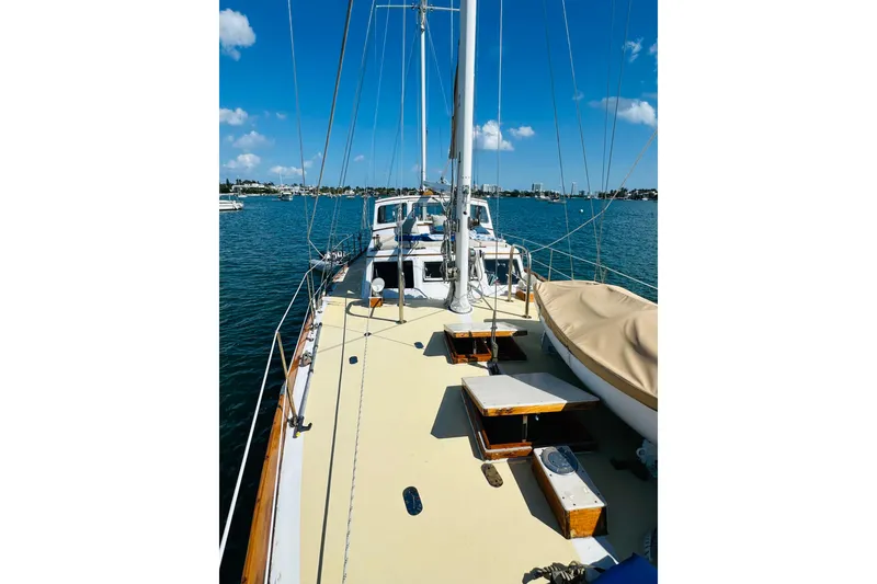 Slide: The Image of 1971 Alden Boothbay Explorer sailboat on calm blue water under clear sky. - 15