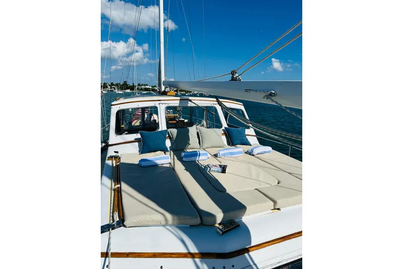 Slide: The Image of 1971 Alden Boothbay Explorer yacht with sunbathing deck, cushions, and towels on a sunny day. - 16
