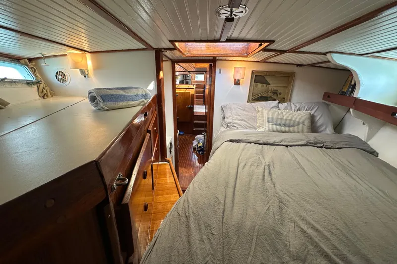 Slide: The Image of Cozy cabin interior of 1971 Alden Boothbay Explorer yacht with bed and wooden furnishings. - 37