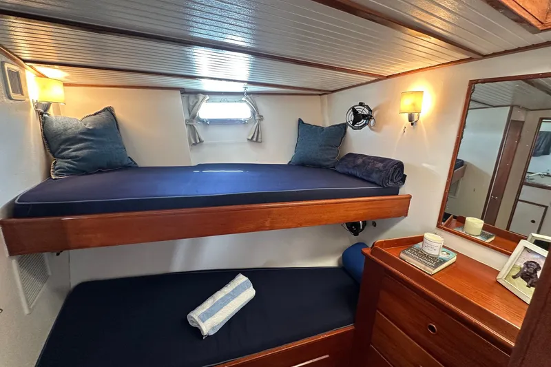 Slide: The Image of Cozy cabin interior of 1971 Alden Boothbay Explorer with bunk beds and nautical decor. - 41