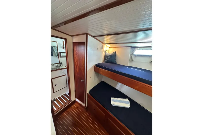 Slide: The Image of Interior of 1971 Alden Boothbay Explorer with wooden bunk beds and nautical decor. - 42
