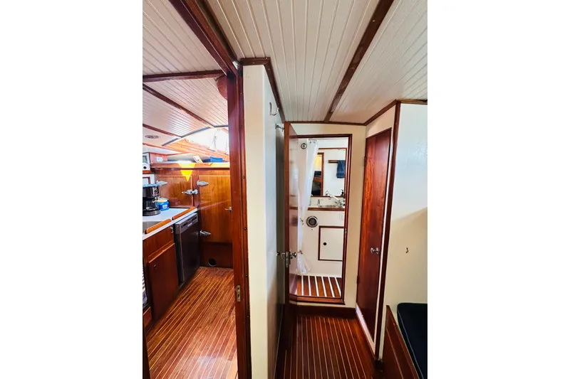 Slide: The Image of Interior of 1971 Alden Boothbay Explorer yacht with wooden finishes and compact kitchen. - 44