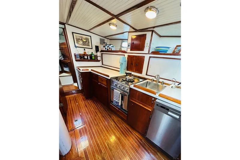 Slide: The Image of 1971 Alden Boothbay Explorer yacht kitchen with wood flooring and modern appliances. - 48