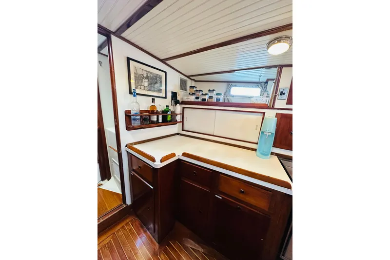 Slide: The Image of 1971 Alden Boothbay Explorer yacht interior with wooden cabinetry and countertop. - 51