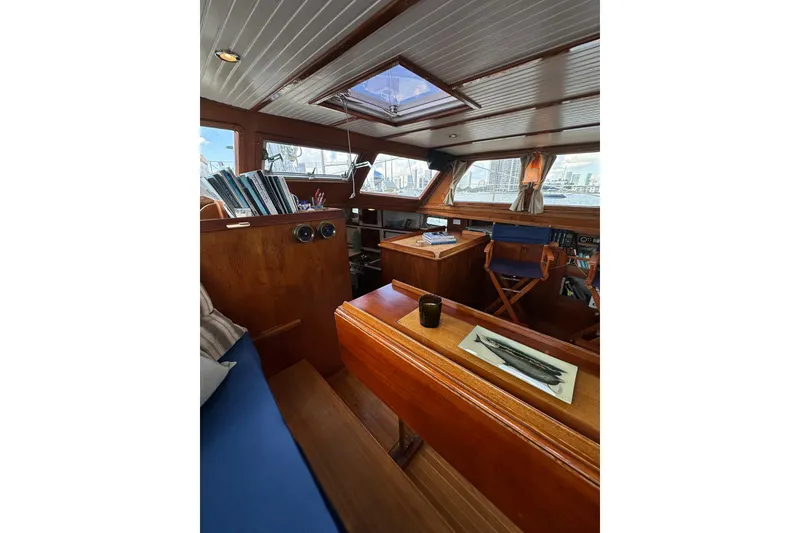 Slide: The Image of Interior of 1971 Alden Boothbay Explorer yacht with wooden furnishings and nautical decor. - 56