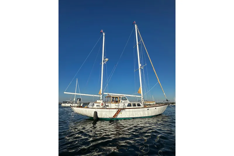 Slide: The Image of Sailboat on water, Alden Boothbay Explorer, 1971 model, under clear blue sky. - 6