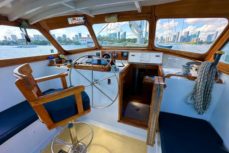 Slide: The Image of Interior of 1971 Alden Boothbay Explorer boat with city skyline view through windows. - 69