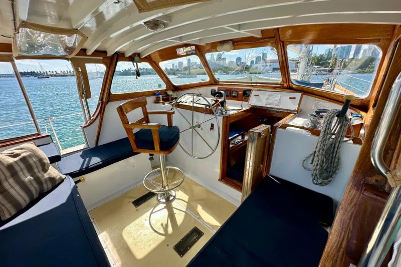 Slide: The Image of Interior of 1971 Alden Boothbay Explorer boat with wooden helm and ocean view. - 72