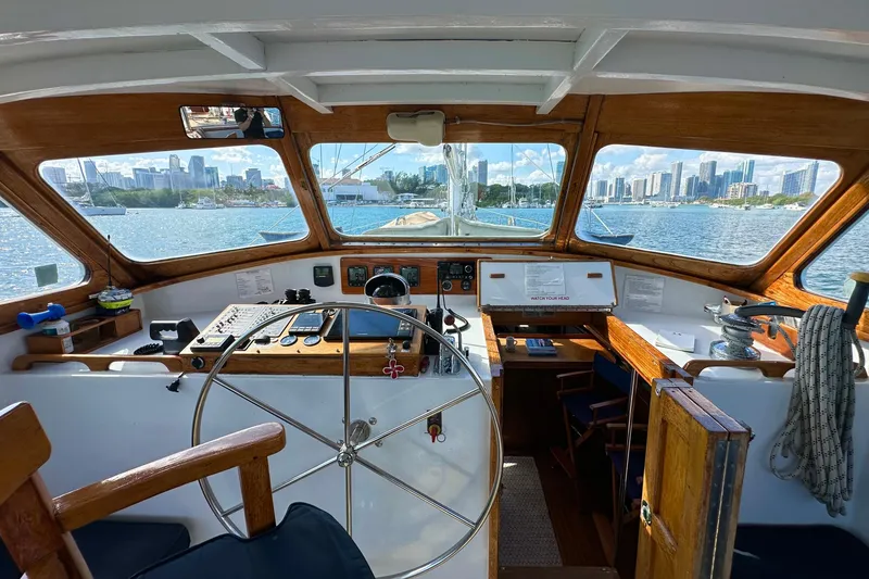 Slide: The Image of Interior view of 1971 Alden Boothbay Explorer yacht cockpit with city skyline in background. - 73