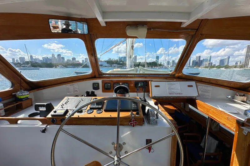 Slide: The Image of Interior view of 1971 Alden Boothbay Explorer yacht cockpit with city skyline in background. - 74