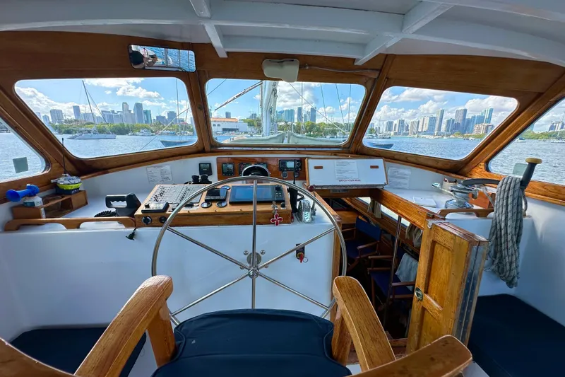 Slide: The Image of 1971 Alden Boothbay Explorer yacht cockpit with city skyline view through windows. - 76