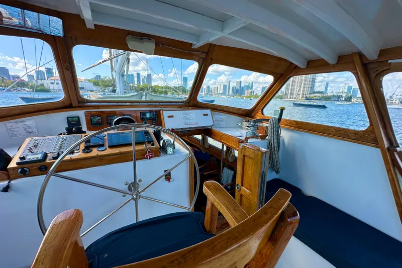 Slide: The Image of Interior view of 1971 Alden Boothbay Explorer boat with city skyline in background. - 77