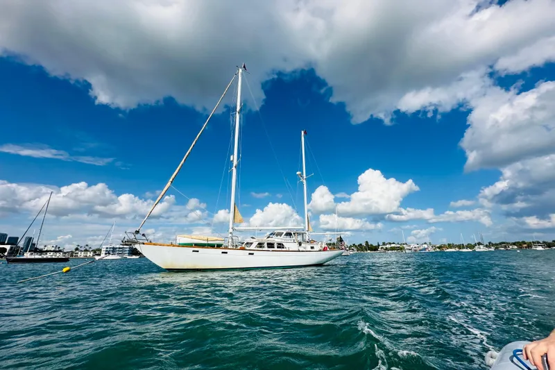 Slide: The Image of Sailboat Alden Boothbay Explorer 1971 on blue ocean under cloudy sky. - 79