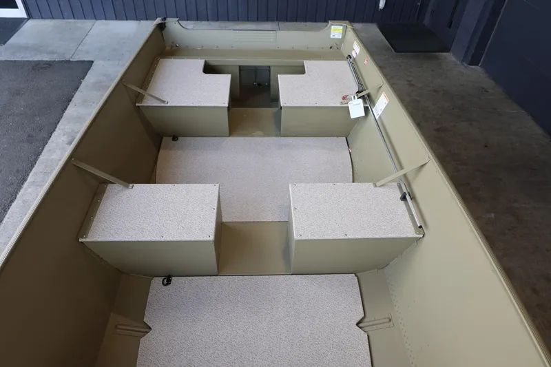 Slide: The Image of 2025 Lund SSV-18 Tiller boat interior with seating and storage compartments. - 11