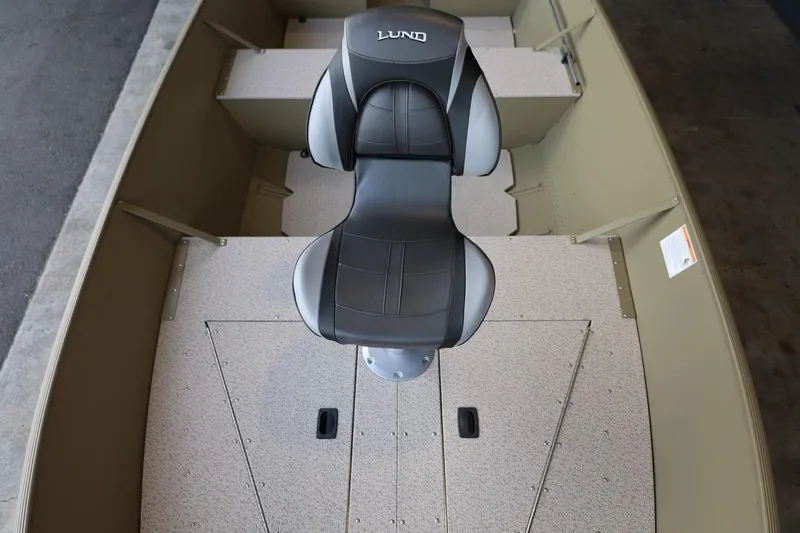 Slide: The Image of 2025 Lund SSV-18 Tiller boat interior with a central black and gray seat. - 12