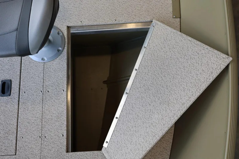 Slide: The Image of 2025 Lund SSV-18 Tiller boat with open storage compartment and seat. - 13