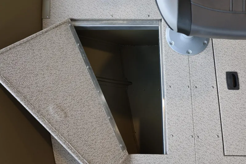Slide: The Image of Open storage compartment in 2025 Lund SSV-18 Tiller boat interior. - 14