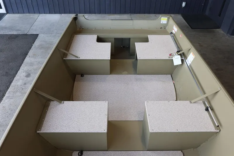 Slide: The Image of 2025 Lund SSV-18 Tiller boat interior with seating and storage compartments. - 15