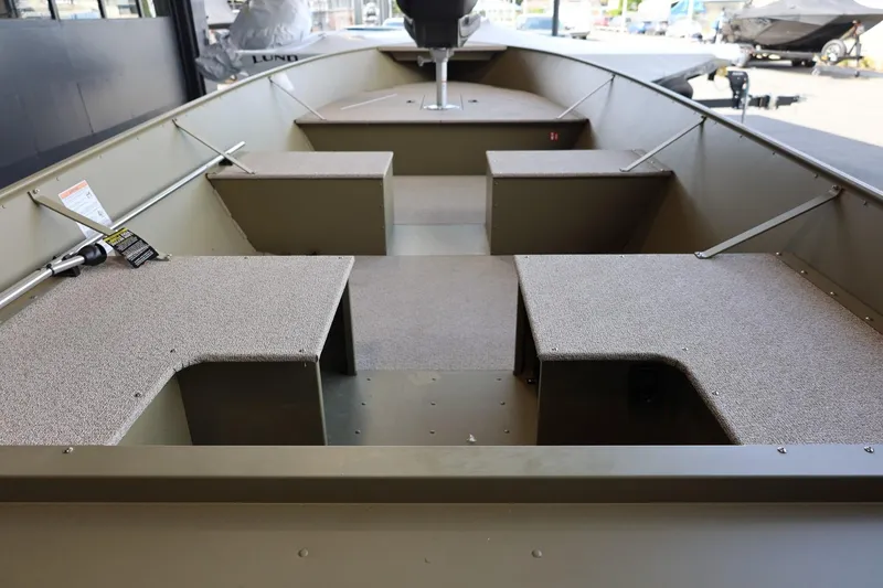 Slide: The Image of 2025 Lund SSV-18 Tiller boat interior with spacious seating and storage areas. - 7