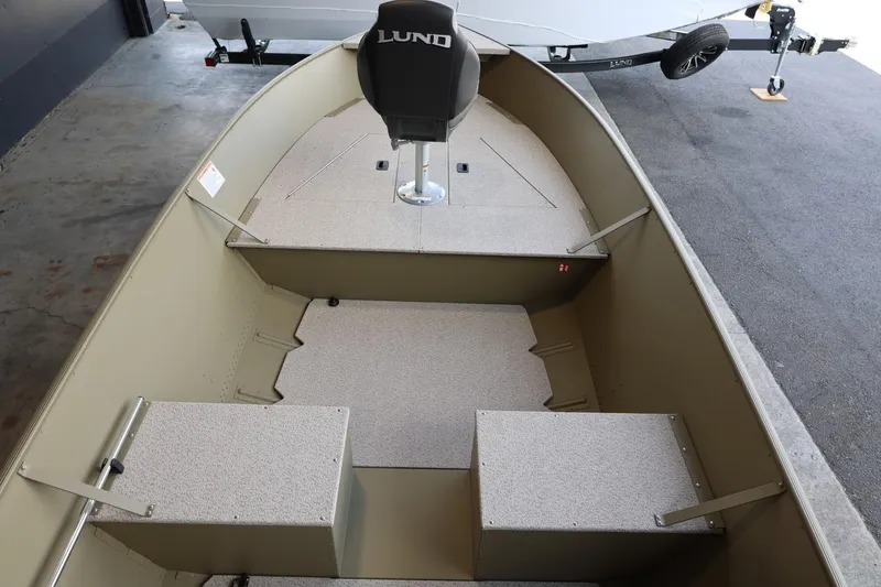 Slide: The Image of 2025 Lund SSV-18 Tiller boat interior with seating and storage compartments. - 9