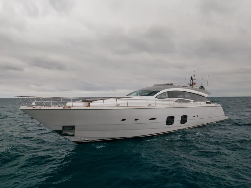 Slide: The Image of Luxury 2018 Pershing 108 yacht cruising on open sea under cloudy skies. - 10