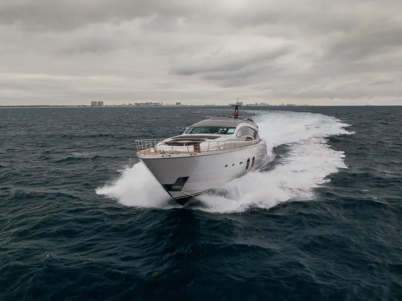Slide: The Image of 2018 Pershing 108 yacht cruising on open sea under cloudy skies. - 11