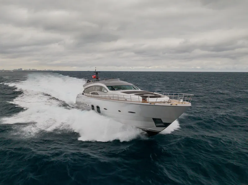 Slide: The Image of Luxury Pershing 108 yacht cruising on open sea under cloudy skies, 2018 model. - 13