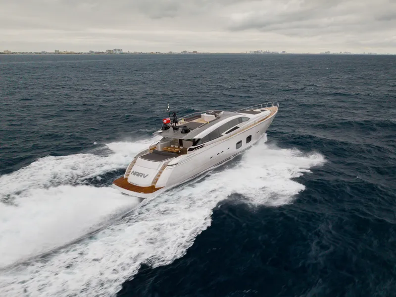 Slide: The Image of 2018 Pershing 108 yacht cruising on open sea under cloudy skies. - 17