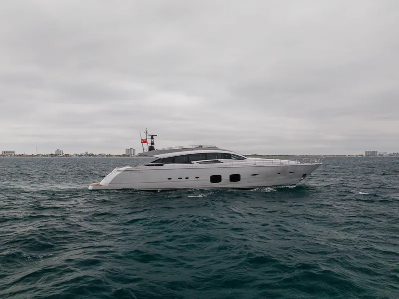 Slide: The Image of 2018 Pershing 108 yacht cruising on open water under cloudy skies. - 2