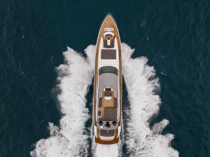 Slide: The Image of Aerial view of 2018 Pershing 108 yacht cruising on the ocean. - 21